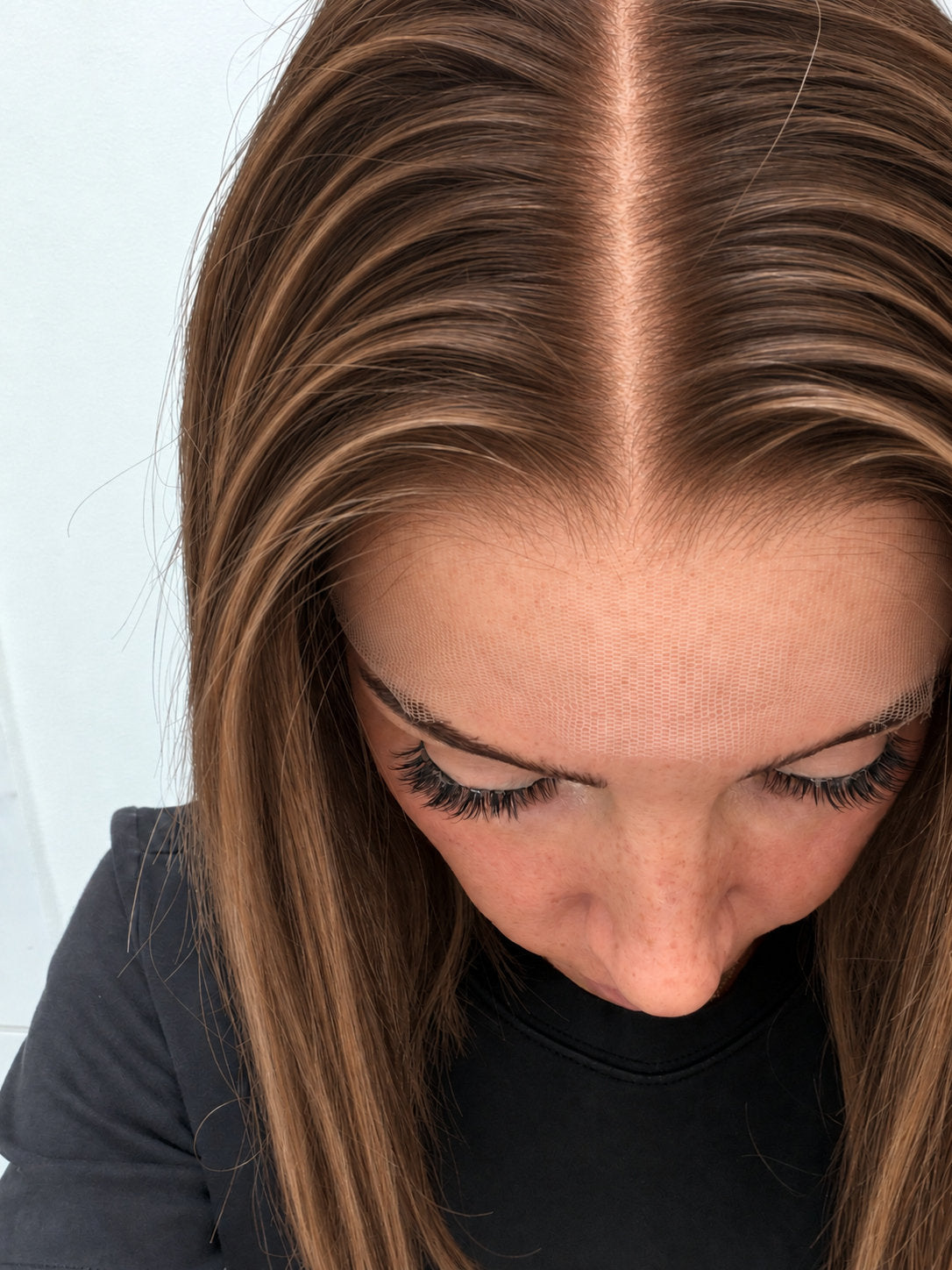 Close-up of the natural lace hairline and parting on a Bronzed Caramel human hair wig