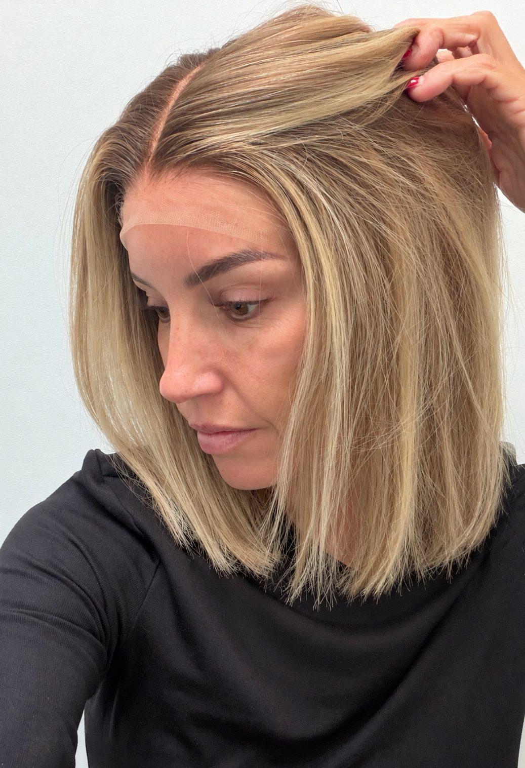 Champagne Melt 12-inch straight wig in rooted champagne blonde balayage, side view showing the hairline