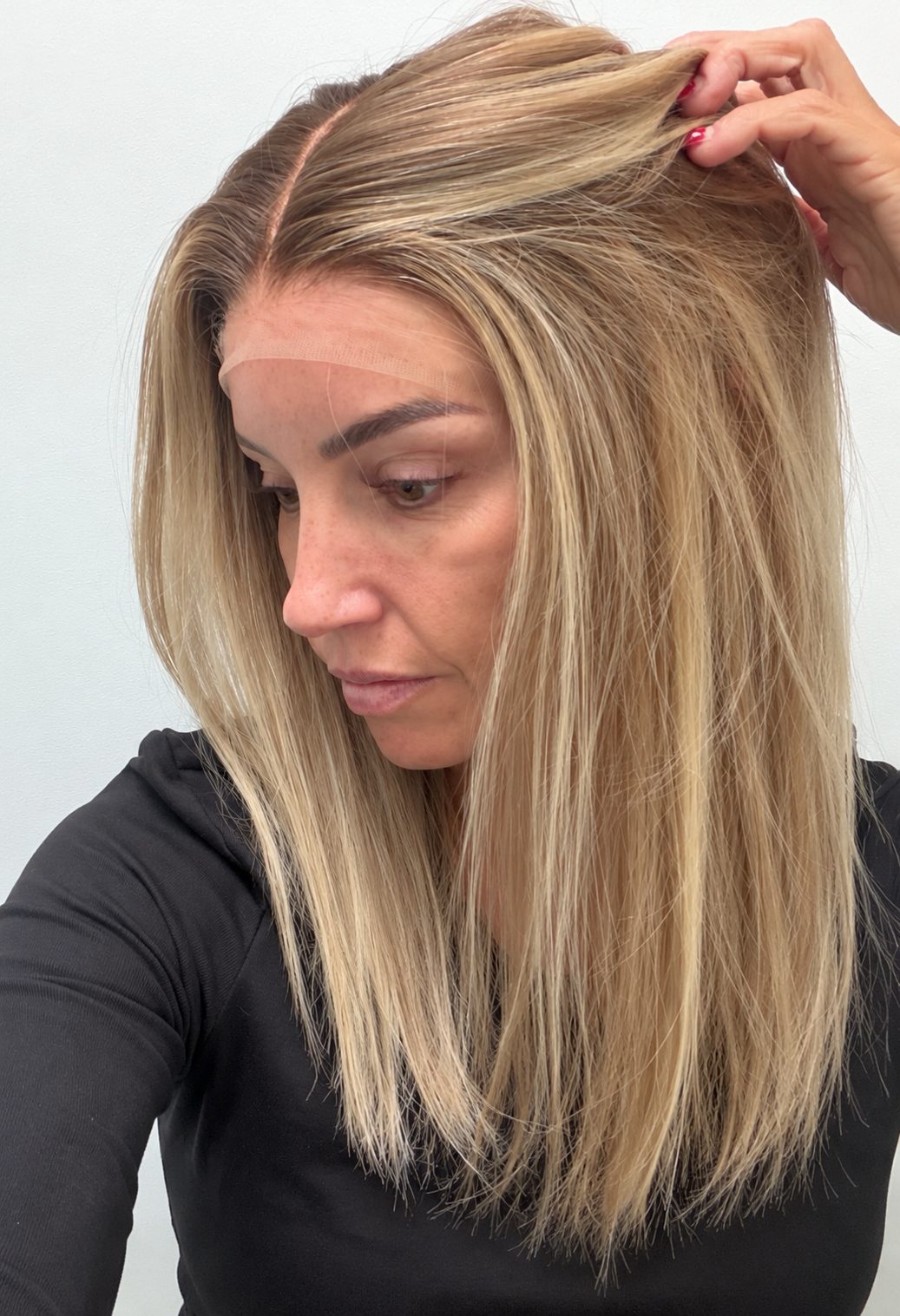 Champagne Melt 18-inch straight wig in rooted champagne blonde balayage, side view showing the hairline