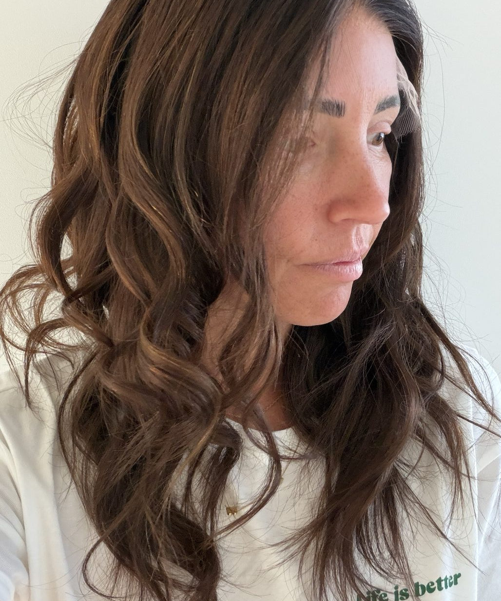 Cinnamon Spice 18-inch wavy wig in warm chocolate brown, side view showing the hairline