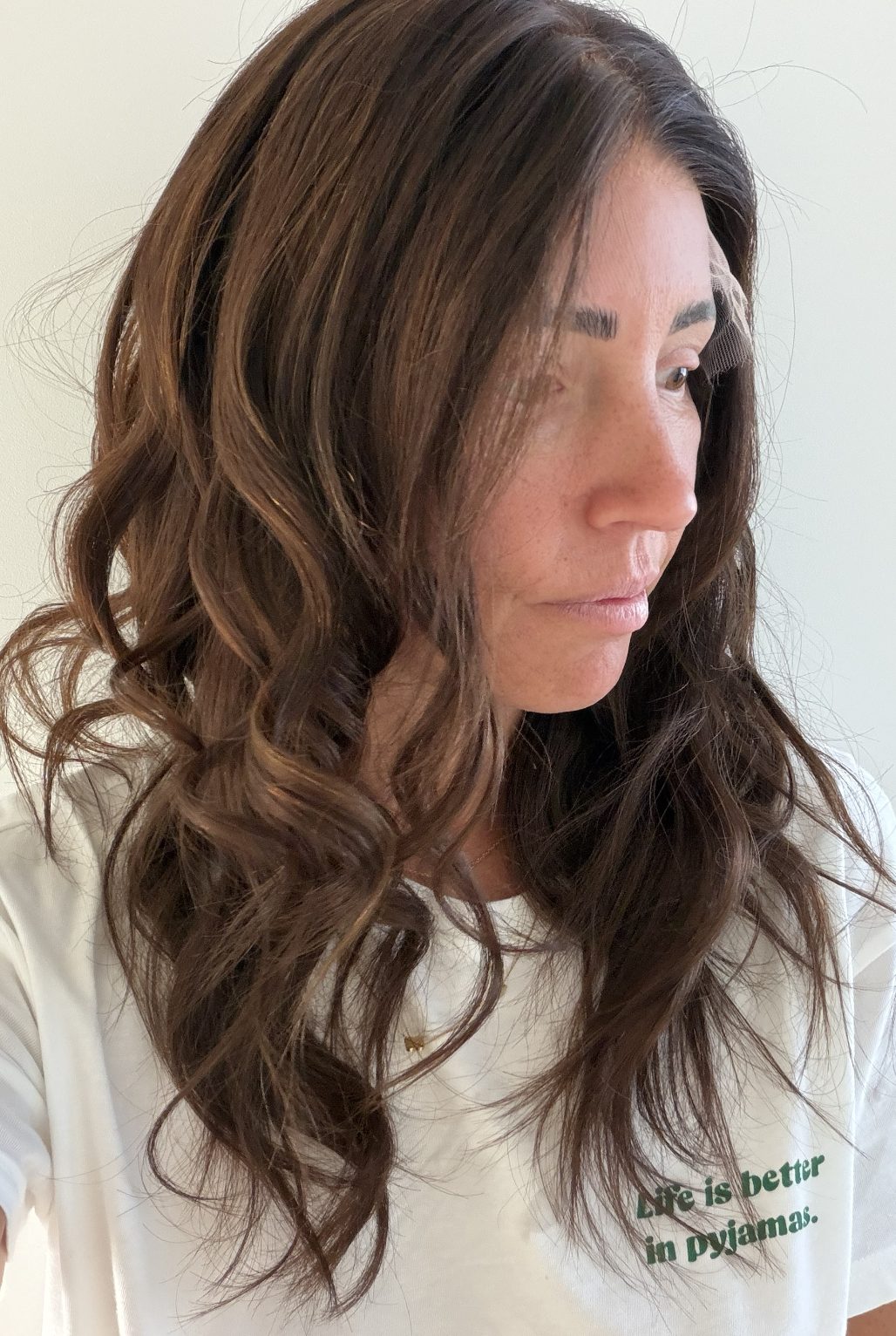 Cinnamon Spice 22-inch wavy wig in warm chocolate brown, side view showing the hairline