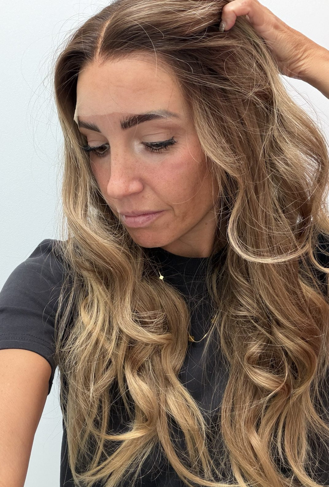 Golden Honey 24-inch wavy wig in golden blonde balayage, side view showing the hairline