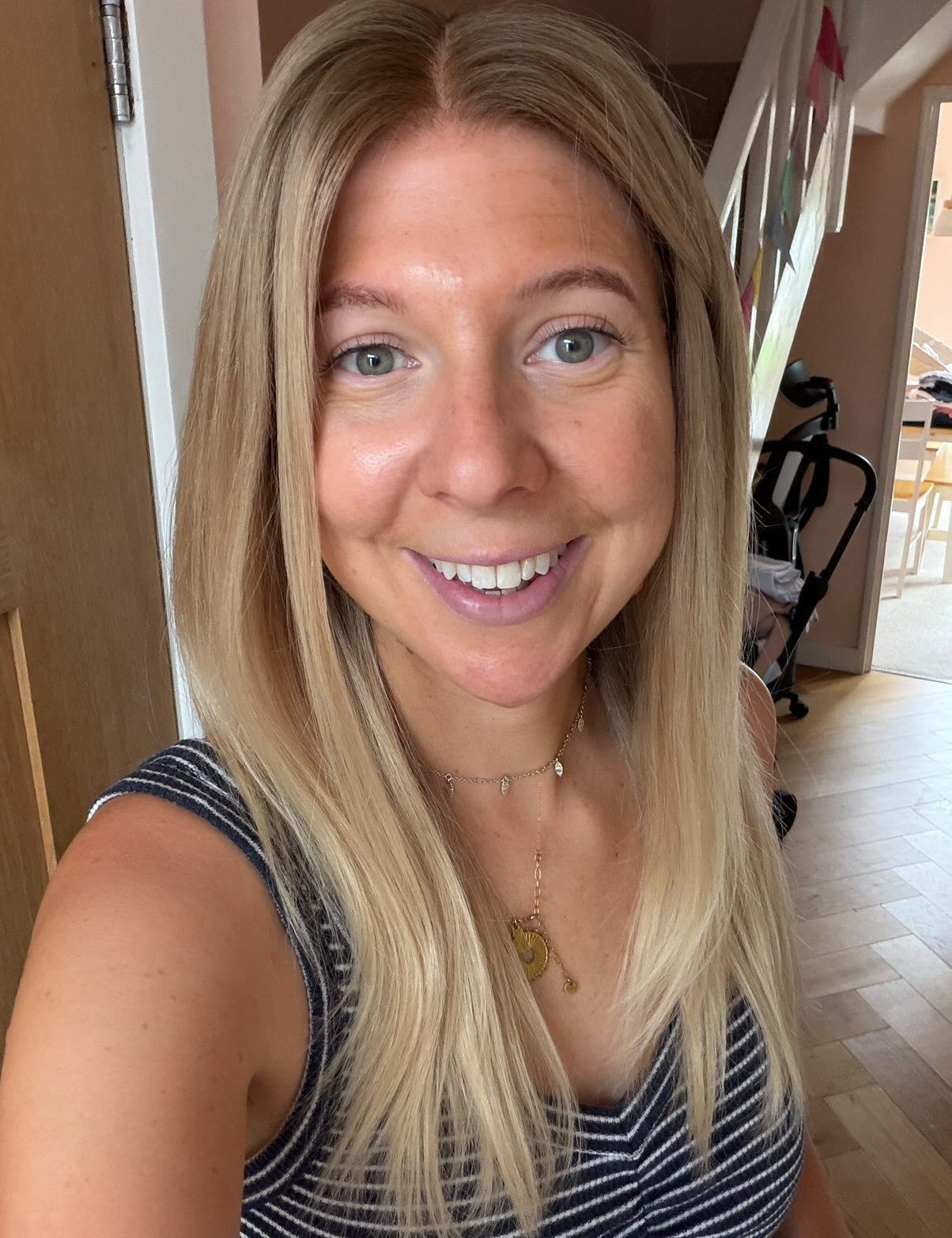 Customer wearing a long honey blonde straight wig