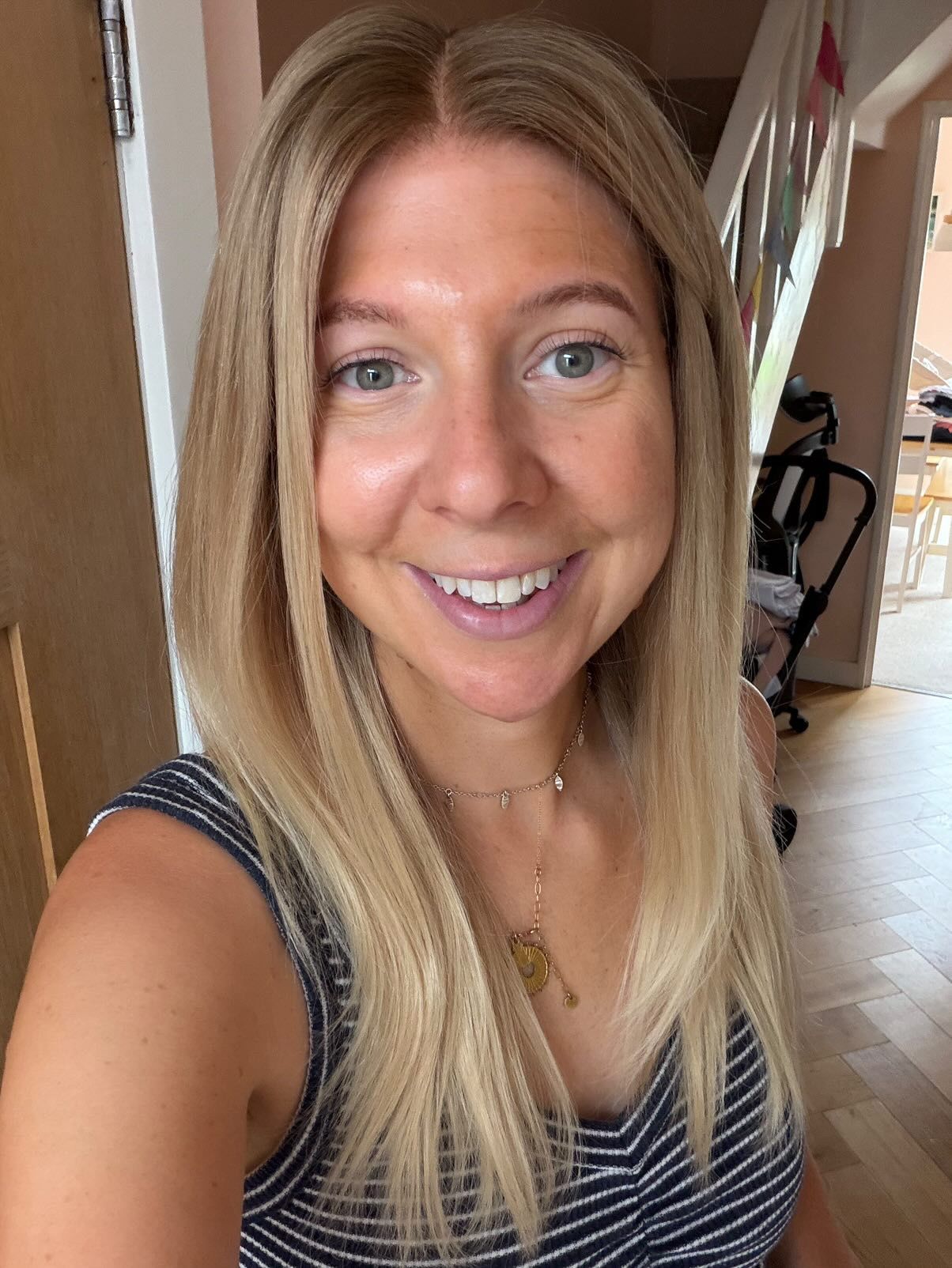 Customer wearing a long honey blonde straight wig
