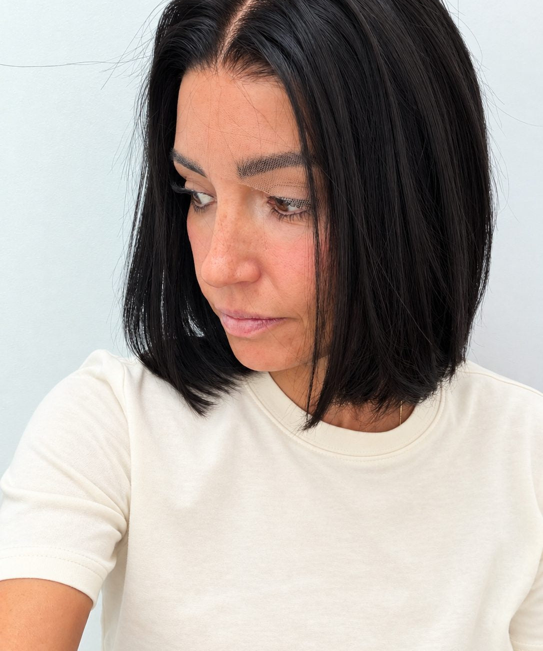 Midnight 10-inch blunt bob wig in jet black, side view showing the hairline