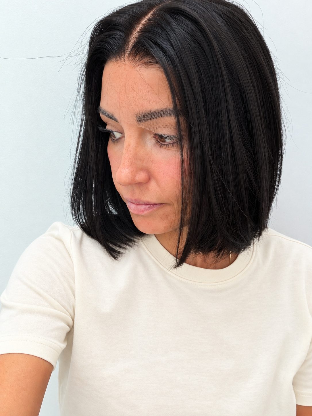 Midnight 10-inch blunt bob wig in jet black, side view showing the hairline