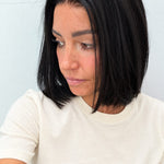 Midnight 10-inch blunt bob wig in jet black, side view showing the hairline