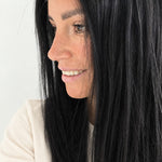 Midnight 16-inch layered straight wig in jet black, side view showing the hairline