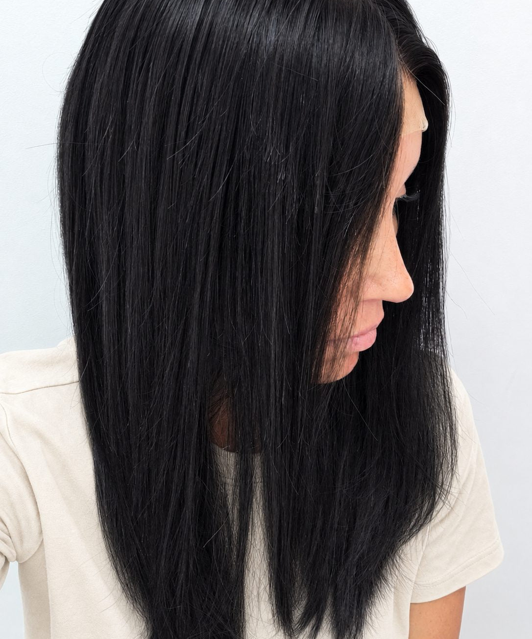 Midnight 18-inch layered straight wig in jet black, side view showing the hairline