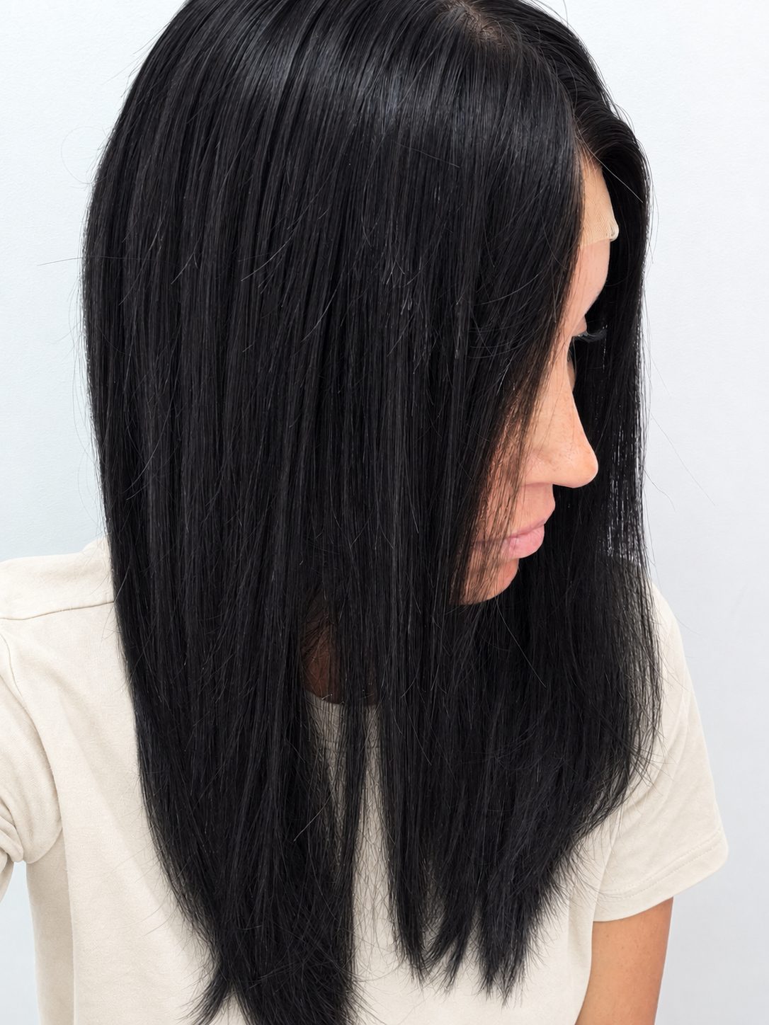 Midnight 18-inch layered straight wig in jet black, side view showing the hairline
