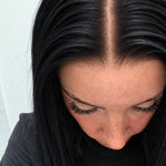 Close-up of the natural lace hairline and parting on a Midnight human hair wig in jet black