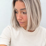 Nordic Pearl 10-inch blunt bob wig in rooted platinum blonde, side view showing the hairline