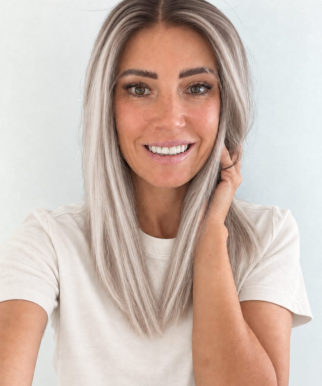 Nordic Pearl 16-inch layered straight wig in rooted platinum blonde, front view