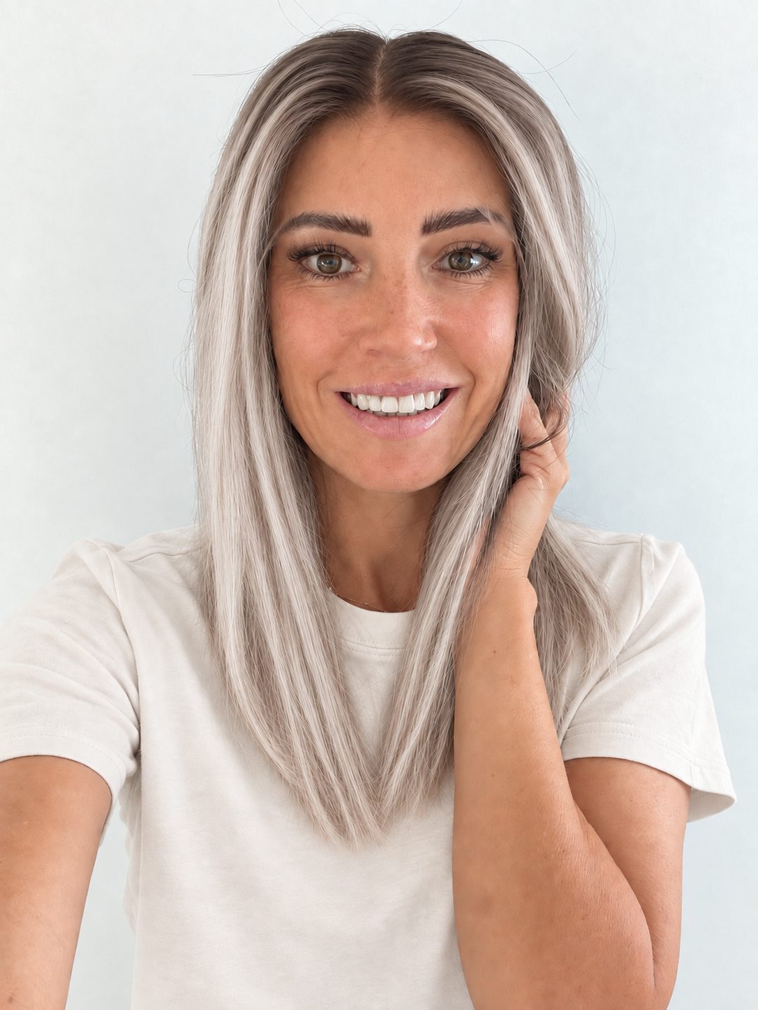Nordic Pearl 16-inch layered straight wig in rooted platinum blonde, front view