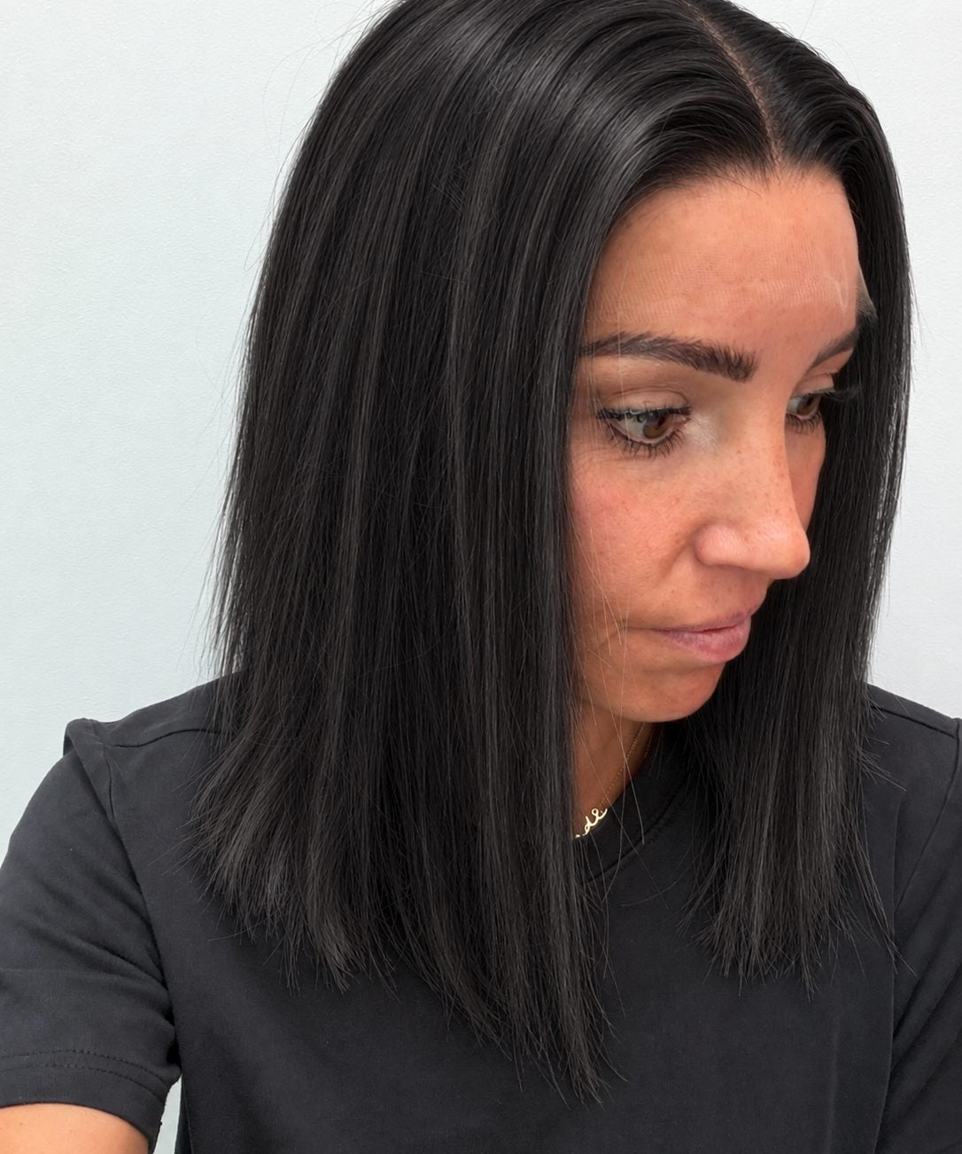 Soft Onyx 14-inch blunt bob wig in soft natural black, side view showing the hairline