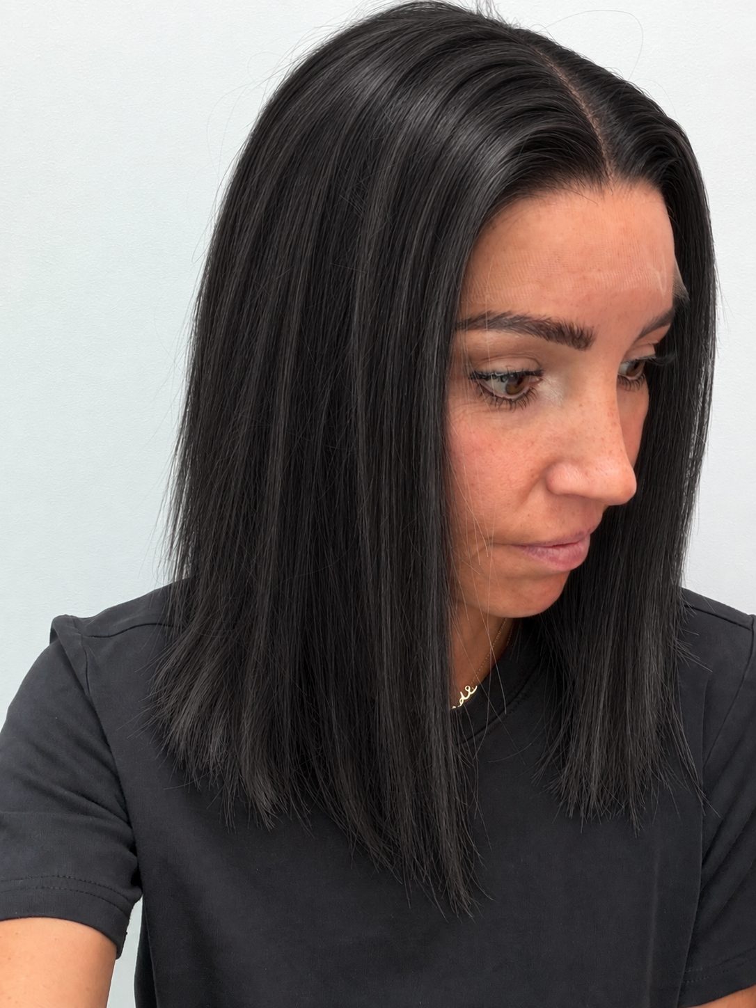 Soft Onyx 14-inch blunt bob wig in soft natural black, side view showing the hairline