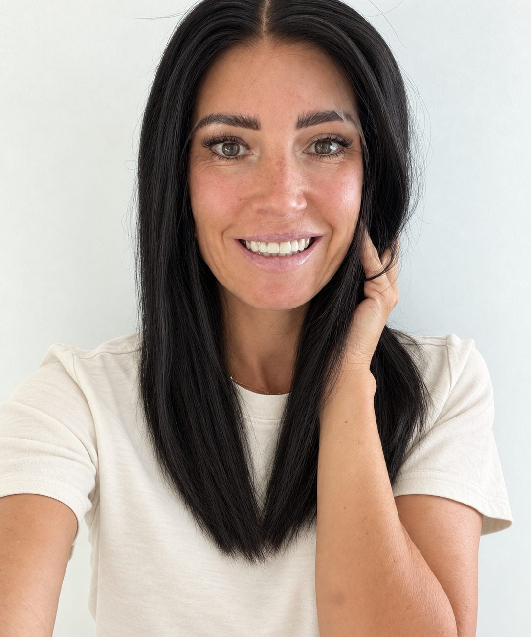 Soft Onyx 16-inch layered straight wig in soft natural black, front view