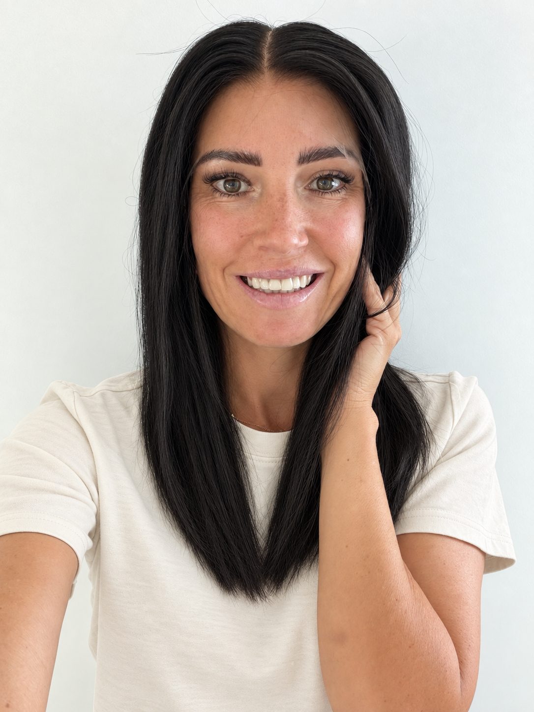 Soft Onyx 16-inch layered straight wig in soft natural black, front view