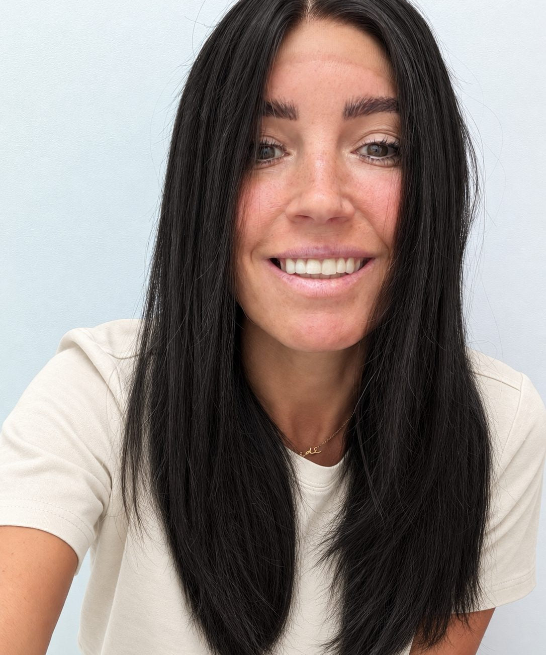 Soft Onyx 18-inch layered straight wig in soft natural black, front view