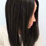Soft Onyx 18-inch layered straight wig in soft natural black, side view showing the hairline