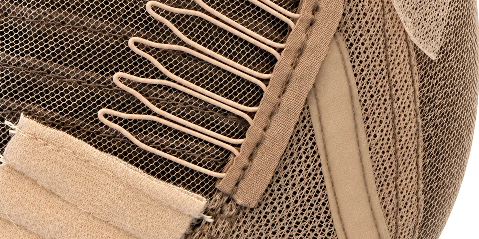 Close-up of the Essential cap ear tab and wig comb