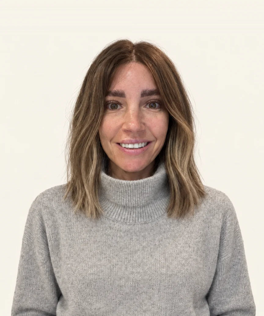 Woman in a grey jumper wearing the 14-inch Lob human hair wig, front view showing where the 14-inch length falls