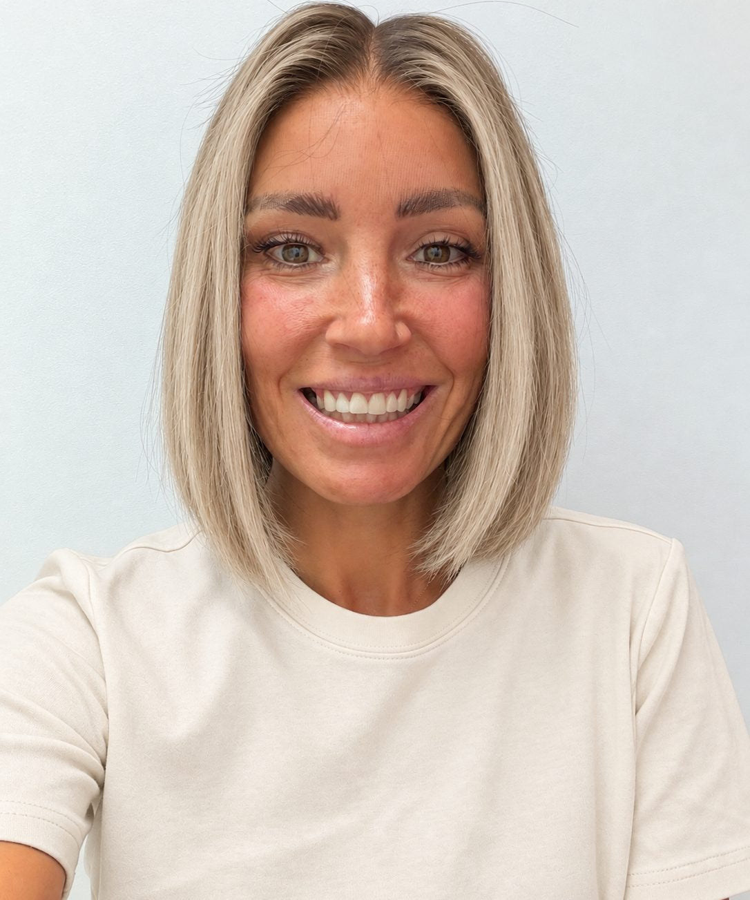 Vanilla Sand 10-inch blunt bob wig in rooted beige blonde, front view