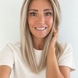 Vanilla Sand 16-inch layered straight wig in rooted beige blonde, front view