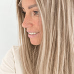Vanilla Sand 16-inch layered straight wig in rooted beige blonde, side view showing the hairline